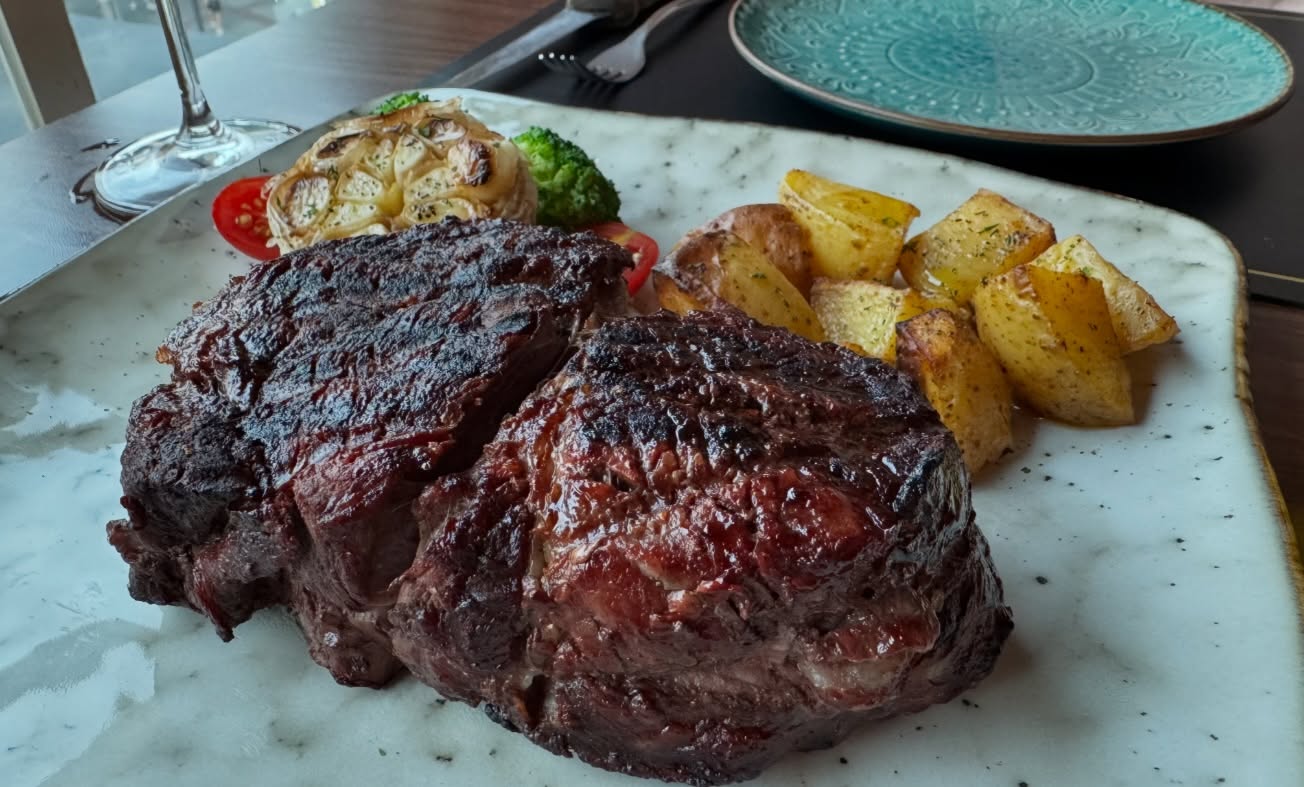 Impressive #argentiniansteakhouse #ribeye 600g with Mushrooms and Cheese #Empanada. The…